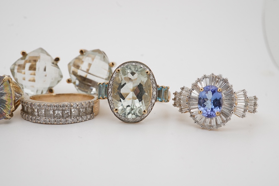 Five modern assorted 9ct gold and gem set rings, including diamond cluster half hoop and a pair of modern 9ct gold and gem set earrings, gross 38.4 grams. Condition - fair to good